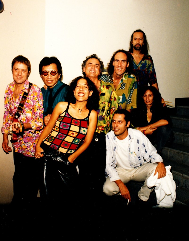 March 1998 (left-to-right): Willem Moller, Sixto Rodriguez, Tonia Selley, Steve Louw, Graeme Currie, Reuben Samuels, crouching: Russel Taylor, sitting on the steps: a friend of the band